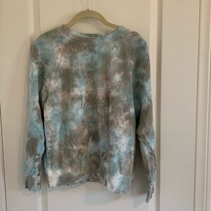 ON tie-dyed sweatshirt.
